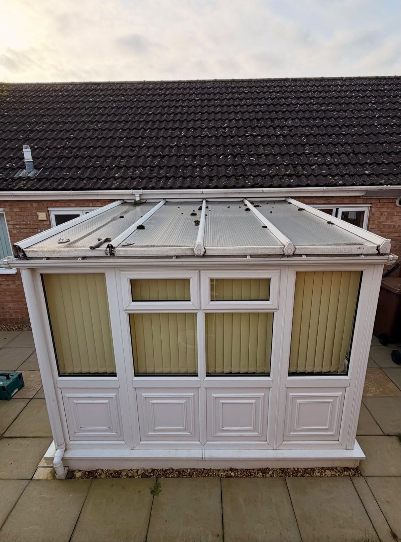 Polycarbonate roof to EPDM warm roof · Exterior — before
