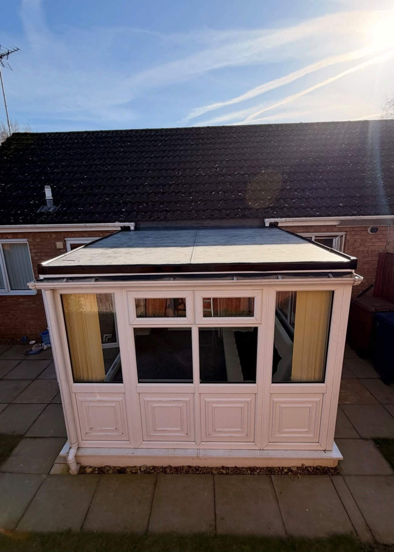 Polycarbonate roof to EPDM warm roof · Exterior — after