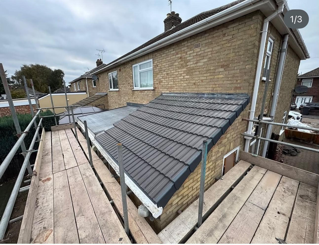 New grey tiled roof after replacement